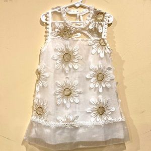 White/ golden dress with hand sewn decorations along with white decorated socks